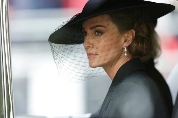 LONDON, ENGLAND - SEPTEMBER 19: Kate Middleton, Princess of Wales is driven down The Mall after the funeral for HM Queen Elizabeth II's funeral on September 19, 2022 in London, England. Elizabeth Alexandra Mary Windsor was born in Bruton Street, Mayfair, London on 21 April 1926. She married Prince Philip in 1947 and ascended the throne of the United Kingdom and Commonwealth on 6 February 1952 after the death of her Father, King George VI. Queen Elizabeth II died at Balmoral Castle in Scotland on September 8, 2022, and is succeeded by her eldest son, King Charles III. (Photo by Tom Jenkins - WPA Pool/Getty Images)