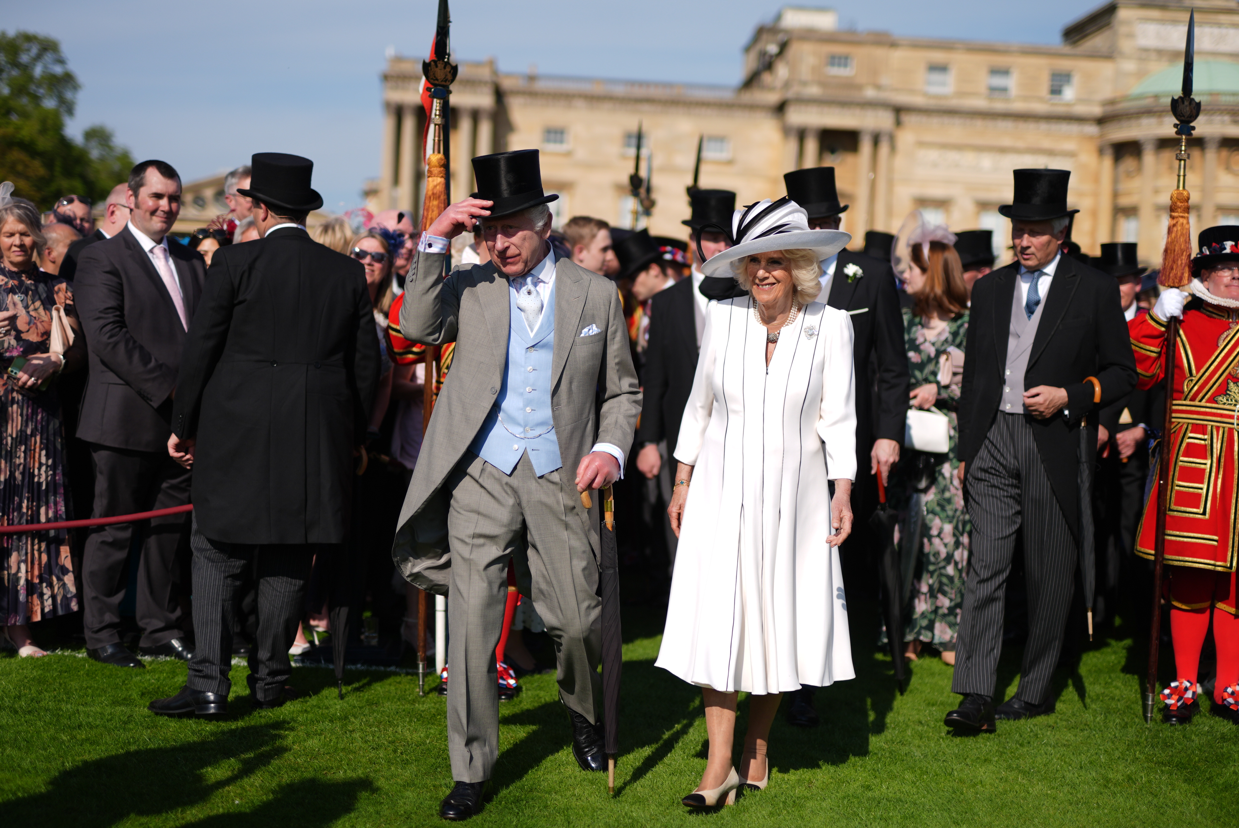 King Charles III and Queen Camilla walking