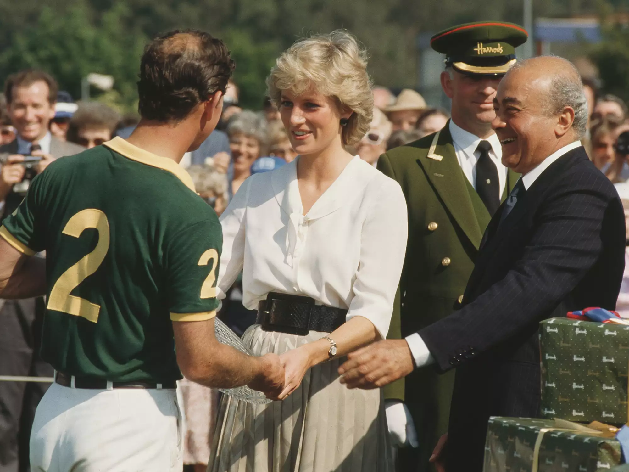 Princess Diana, Prince Charles, and Mohamed Al-Fayed during the Harrods Polo Cup at Smith's Lawn in Windsor, UK, July 1987.