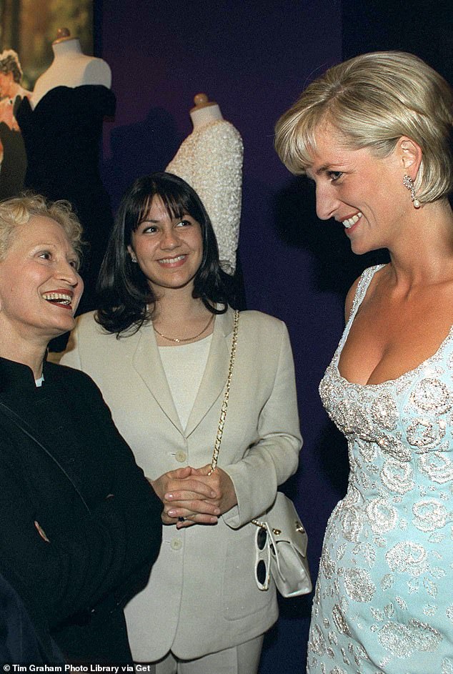 Princess Diana talking to the designer who created the revenge dress, Christina Stambolian (in black jacket)