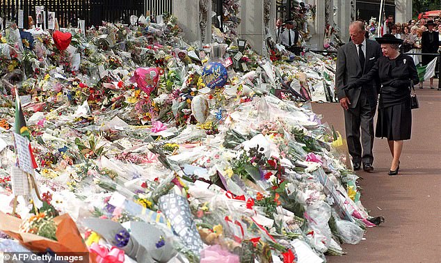 The Duke of Edinburgh and Queen Elizabeth view the thousands of flowers and tributes left outside Kensington Palace in memory of Diana